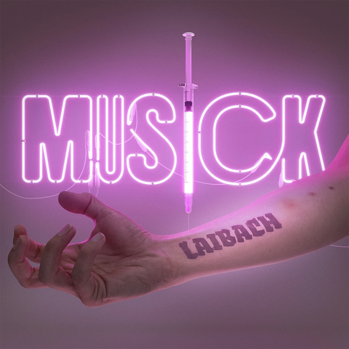 Cover art for Laibach’s MUSICK, showing a neon MUSICK sign and a syringe above an arm tattooed with the word Laibach